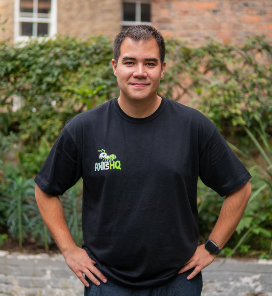 Cesar wearing an Ants HQ T-shirt outdoors