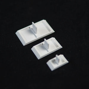 Three empty ant feeding dishes in different sizes