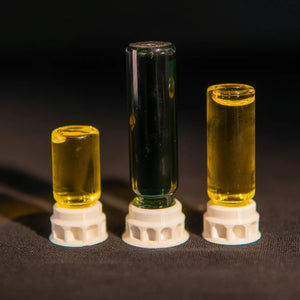 Ant nectar dispenser in a clear tube with white base