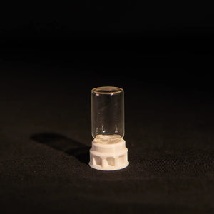 Ant nectar dispenser in a clear tube with white base